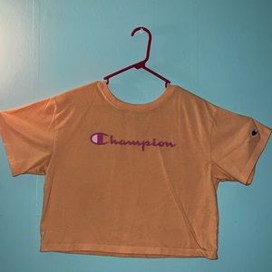 Peach colored Champion crop top.